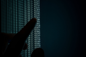 a finger pointing at black screen